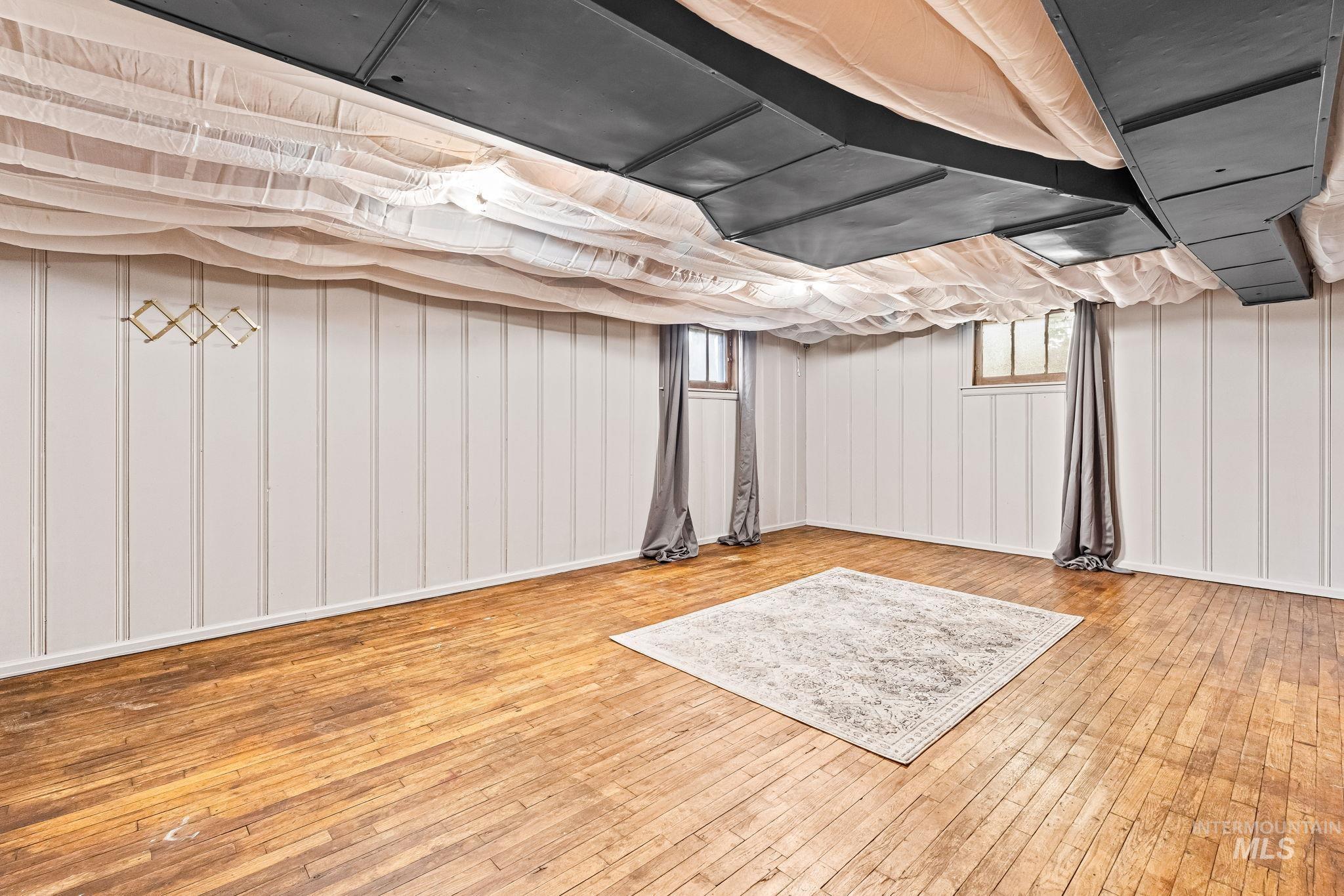 404 North Allumbaugh Street Boise, ID 83704 - Photo 15 of 31 Below grade area with wood-type flooring and plenty of natural light