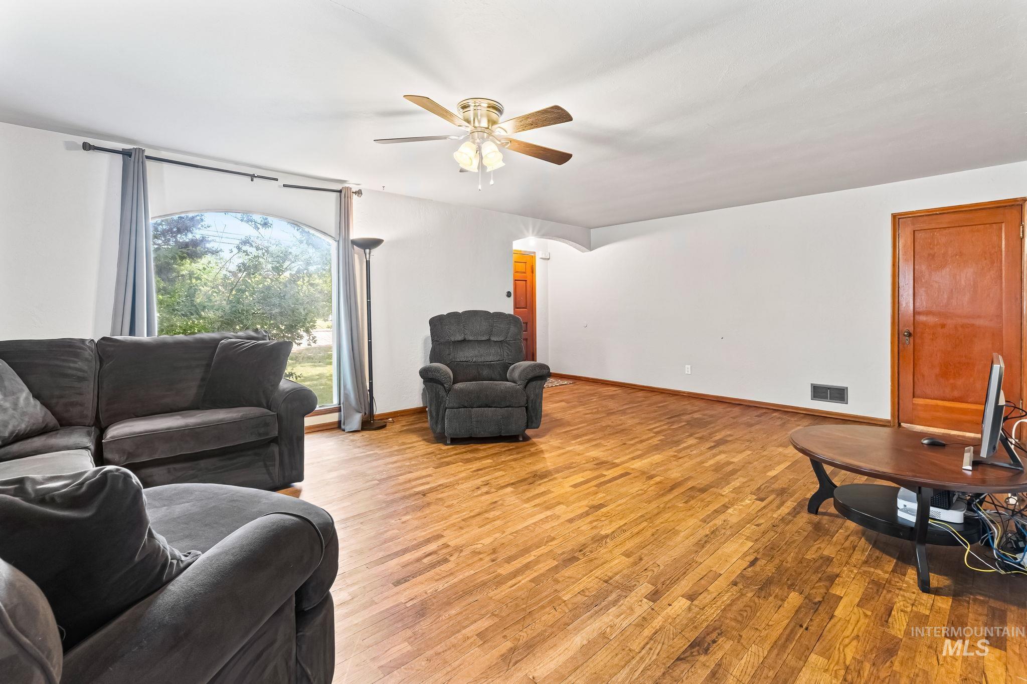404 North Allumbaugh Street Boise, ID 83704 - Photo 26 of 31 Living room with a ceiling fan and light wood-style flooring
