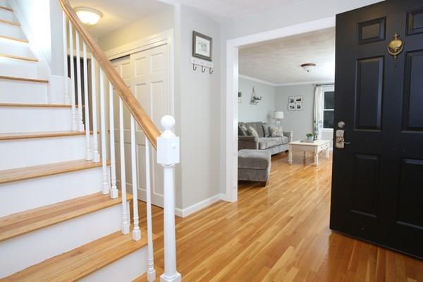 9 Abbott Road Maynard, MA 01754 - Photo 2 of 36 a view of a hallway view with wooden floor and staircase