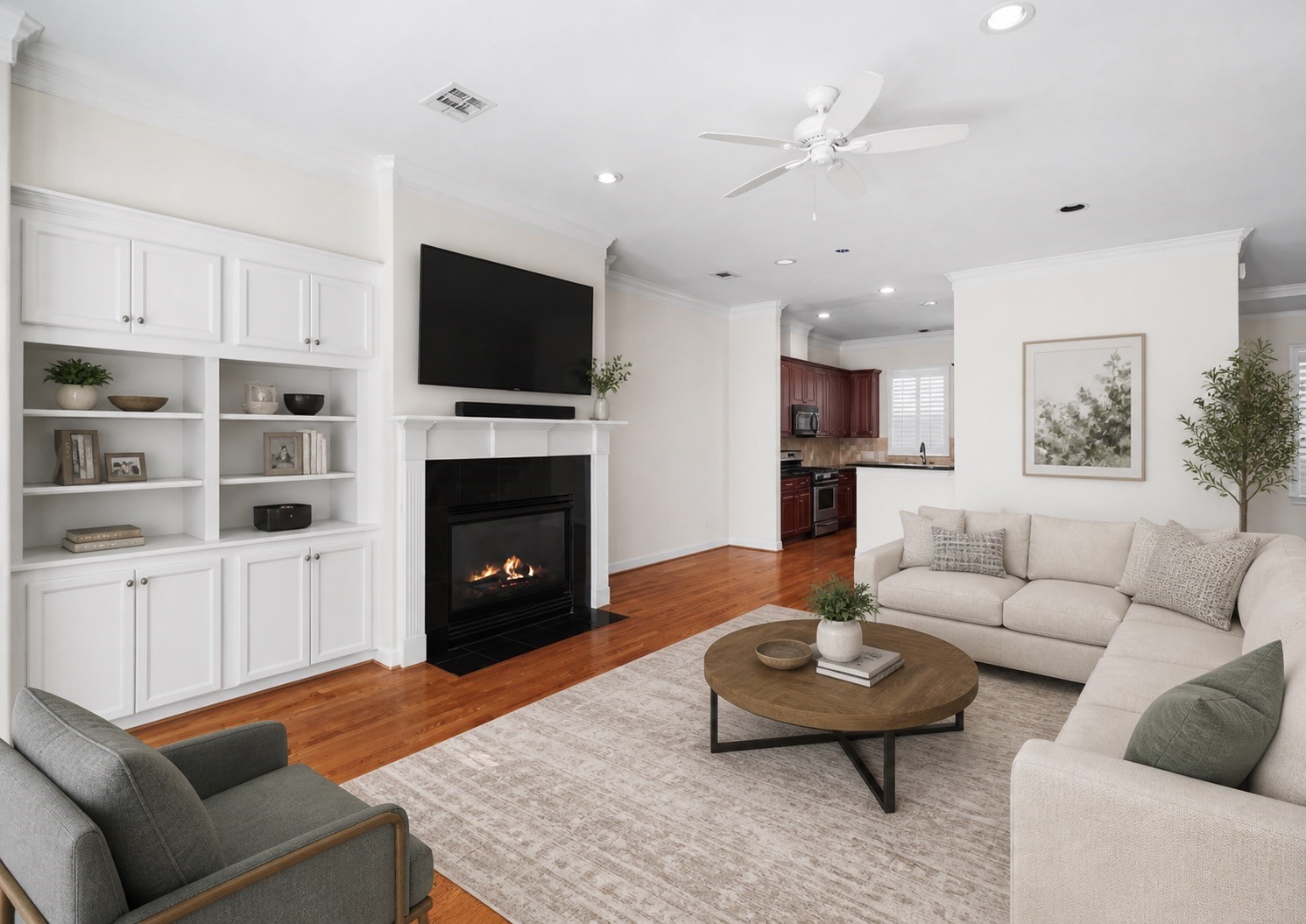2150 Bancroft Lane Houston, TX 77027 - Photo 10 of 25 a living room with furniture a flat screen tv and a fireplace