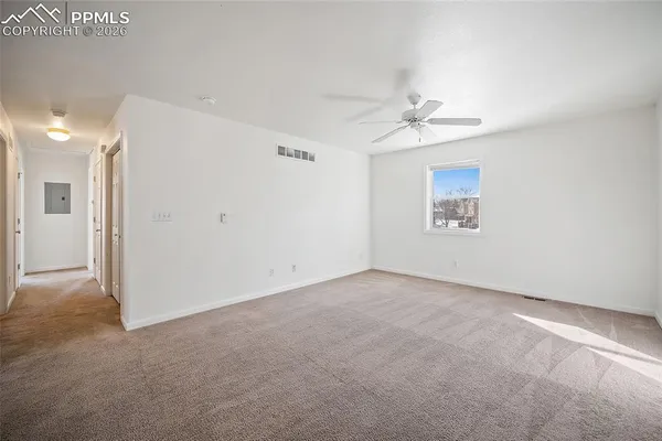 a view of an empty room with a window