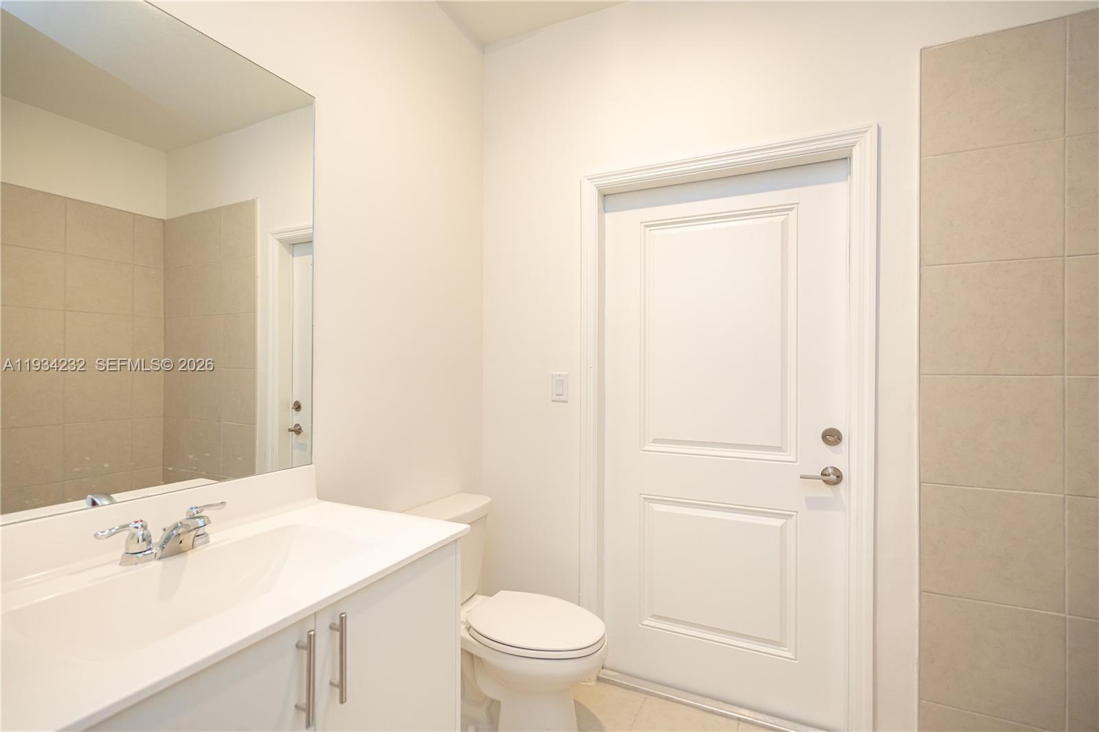 19507 Southwest 339th Terrace Homestead, FL 33034 - Photo 25 of 83 a bathroom with a sink a toilet and a mirror