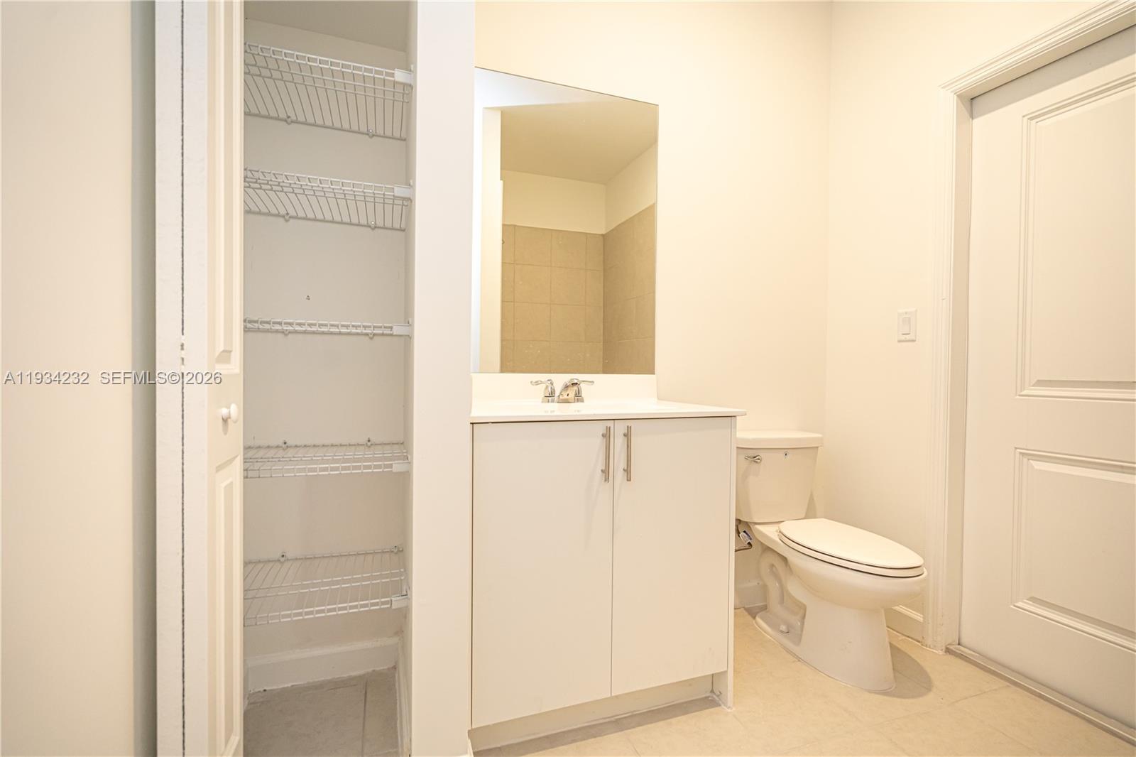 19507 Southwest 339th Terrace Homestead, FL 33034 - Photo 28 of 83 a bathroom with a toilet a sink and a window