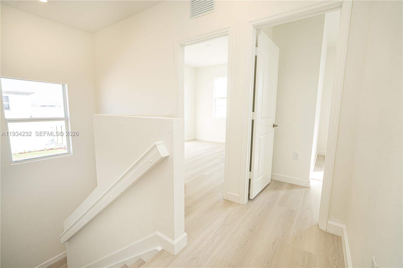 19507 Southwest 339th Terrace Homestead, FL 33034 - Photo 37 of 83 a view of a hallway with wooden floor and staircase