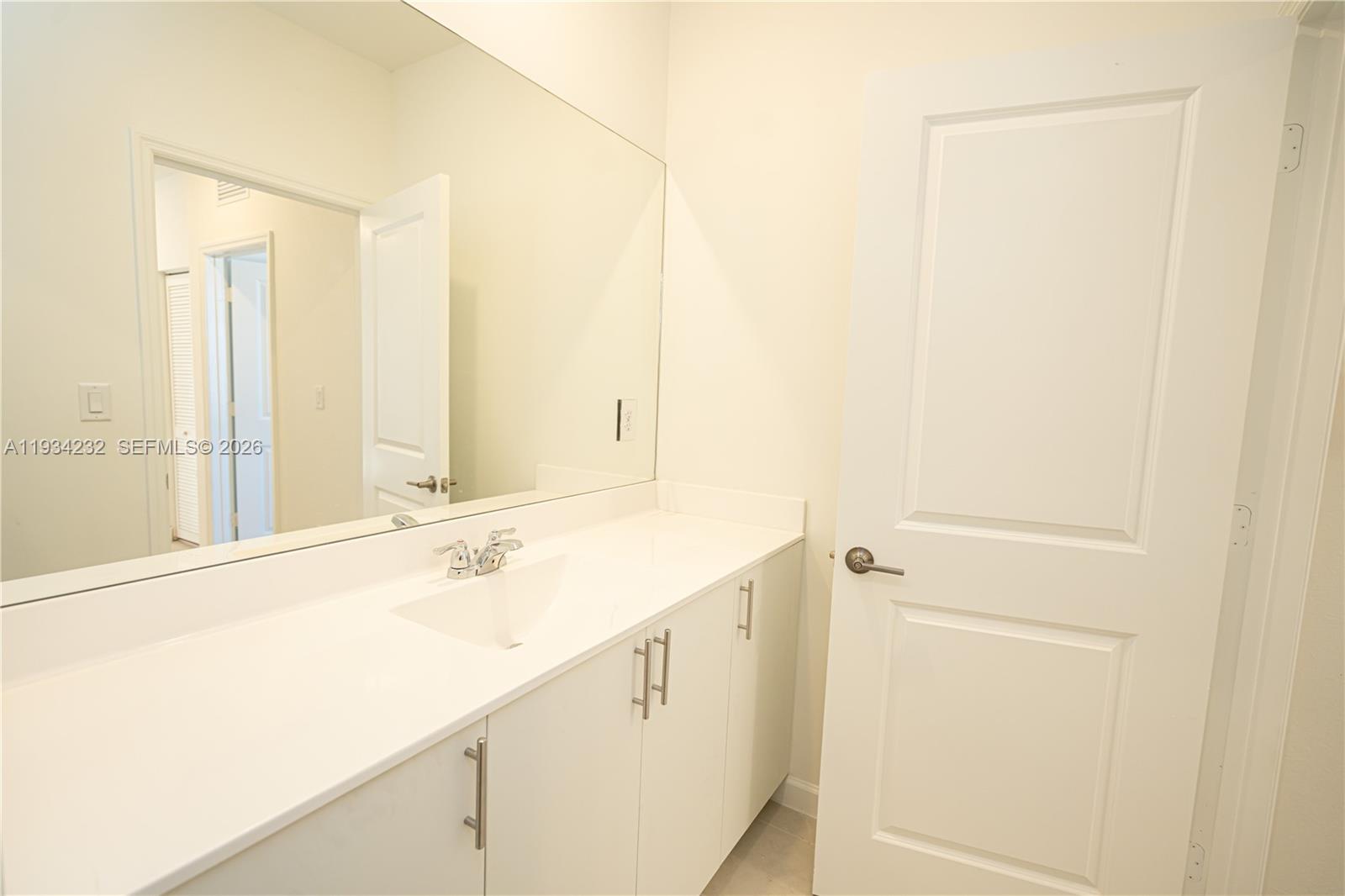 19507 Southwest 339th Terrace Homestead, FL 33034 - Photo 39 of 83 a bathroom with a sink and a mirror