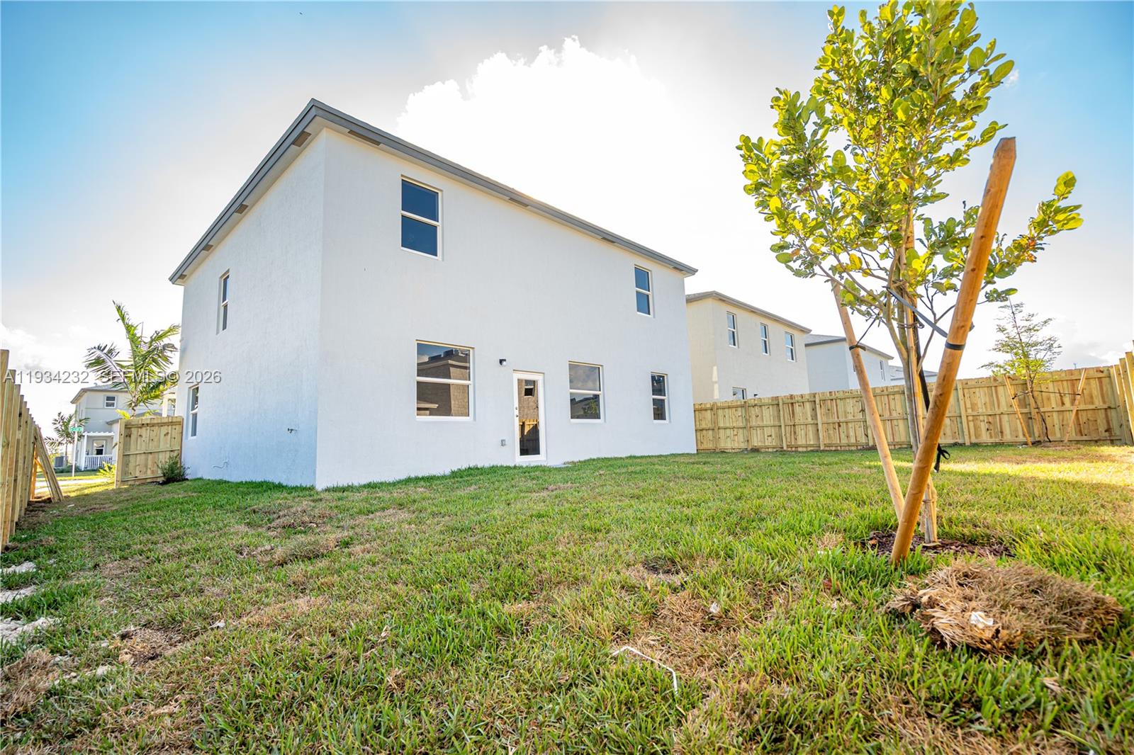19507 Southwest 339th Terrace Homestead, FL 33034 - Photo 4 of 83 a view of a house with backyard and tree