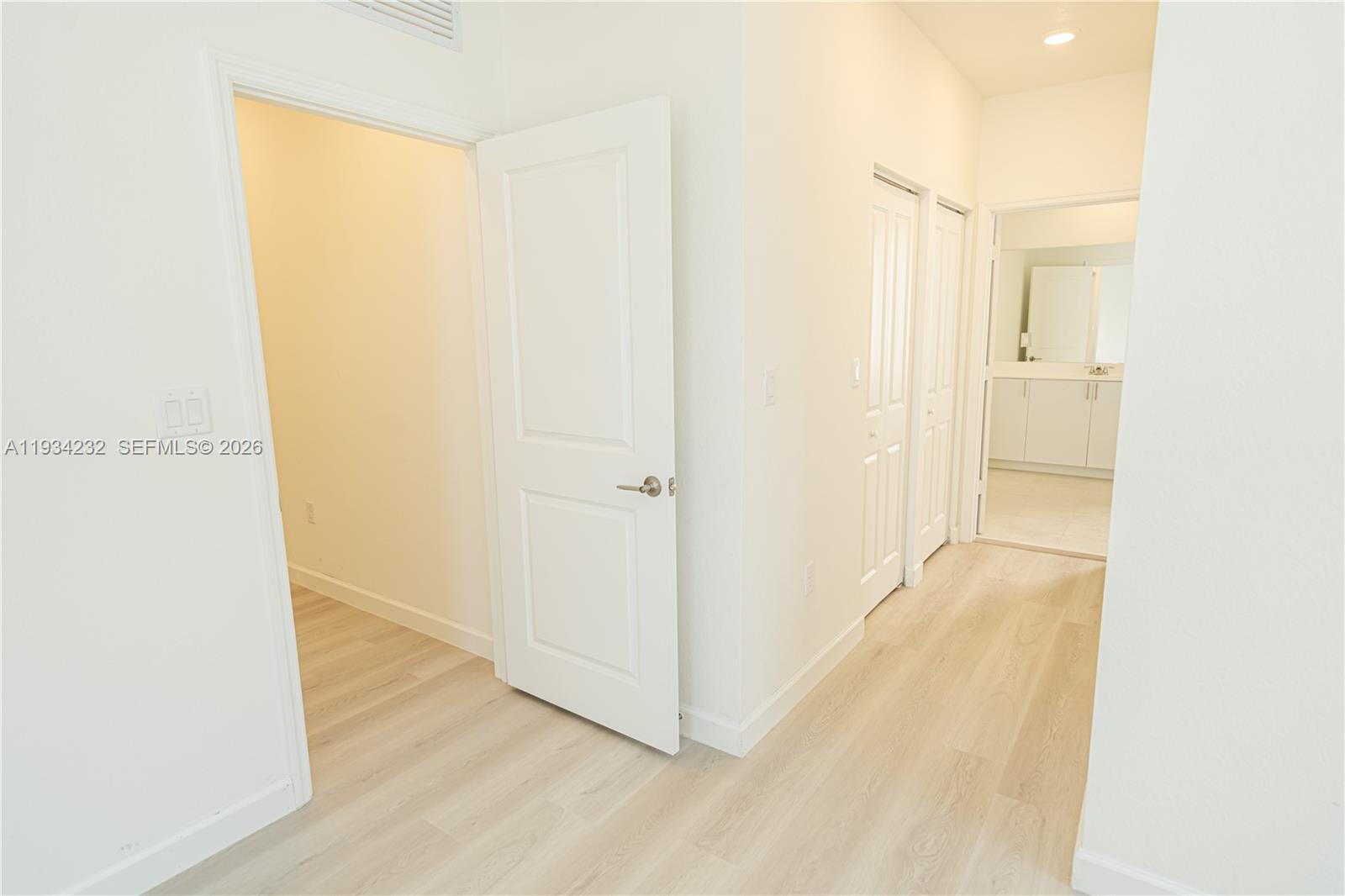19507 Southwest 339th Terrace Homestead, FL 33034 - Photo 54 of 83 a view of a hallway with wooden floor