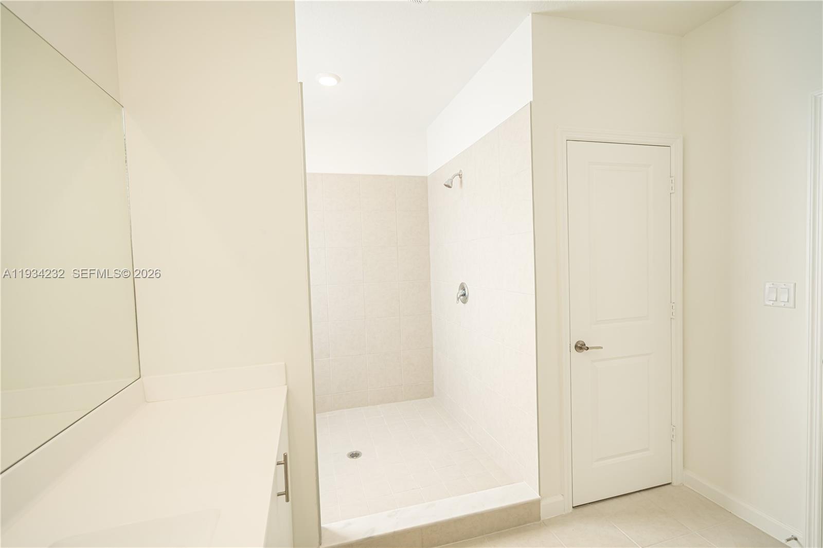 19507 Southwest 339th Terrace Homestead, FL 33034 - Photo 62 of 83 a bathroom with a glass shower door
