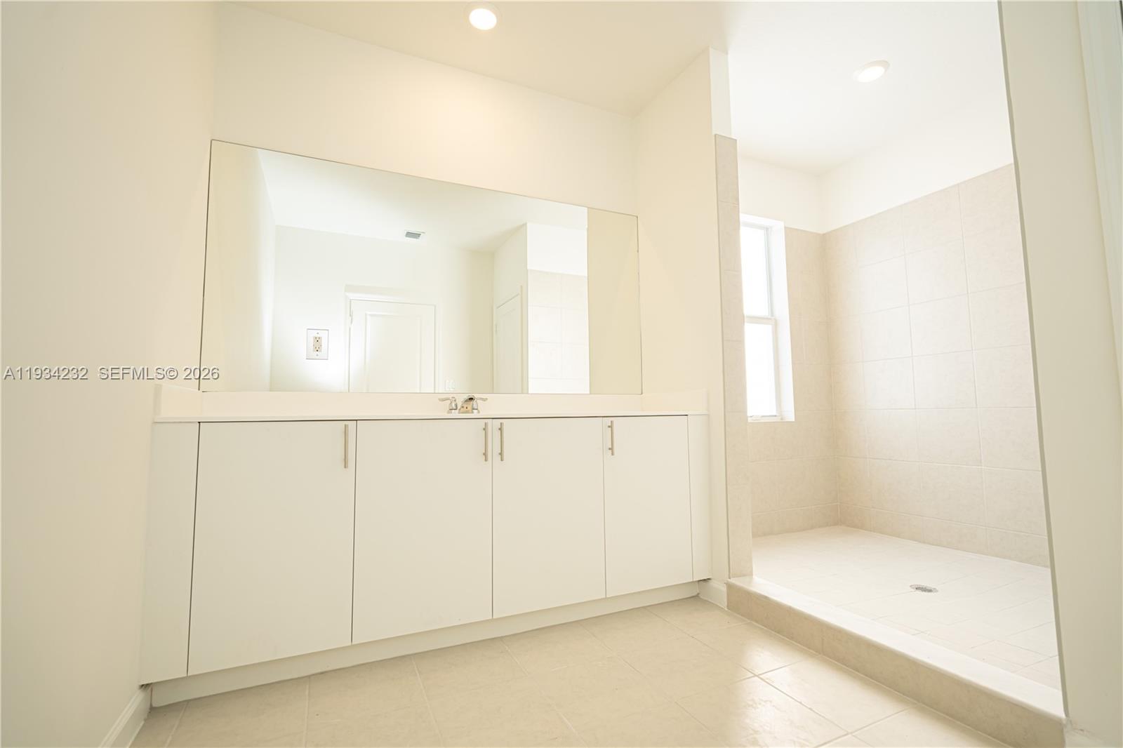 19507 Southwest 339th Terrace Homestead, FL 33034 - Photo 64 of 83 a bathroom with a bathtub and a shower