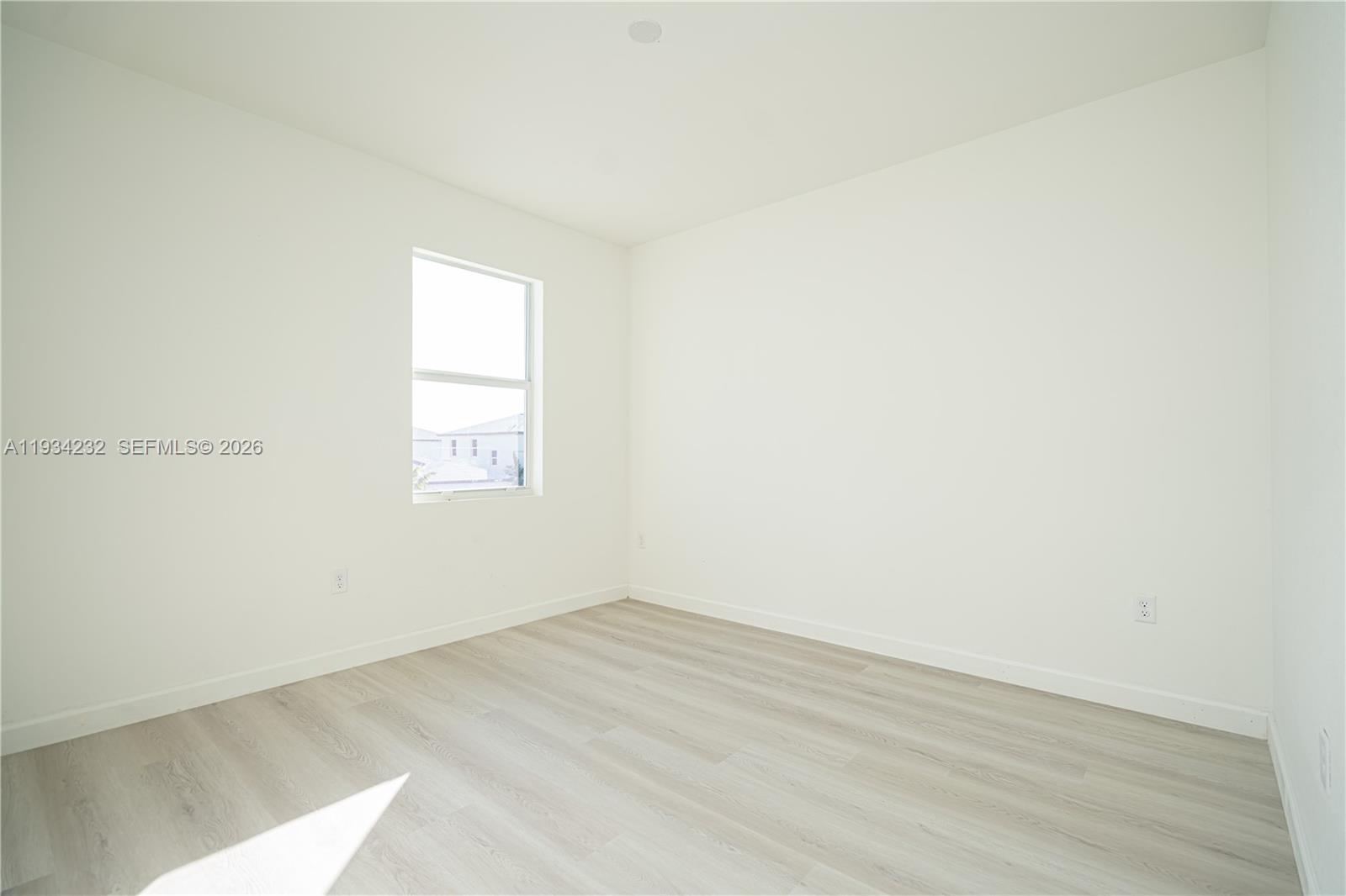 19507 Southwest 339th Terrace Homestead, FL 33034 - Photo 70 of 83 an empty room with a window