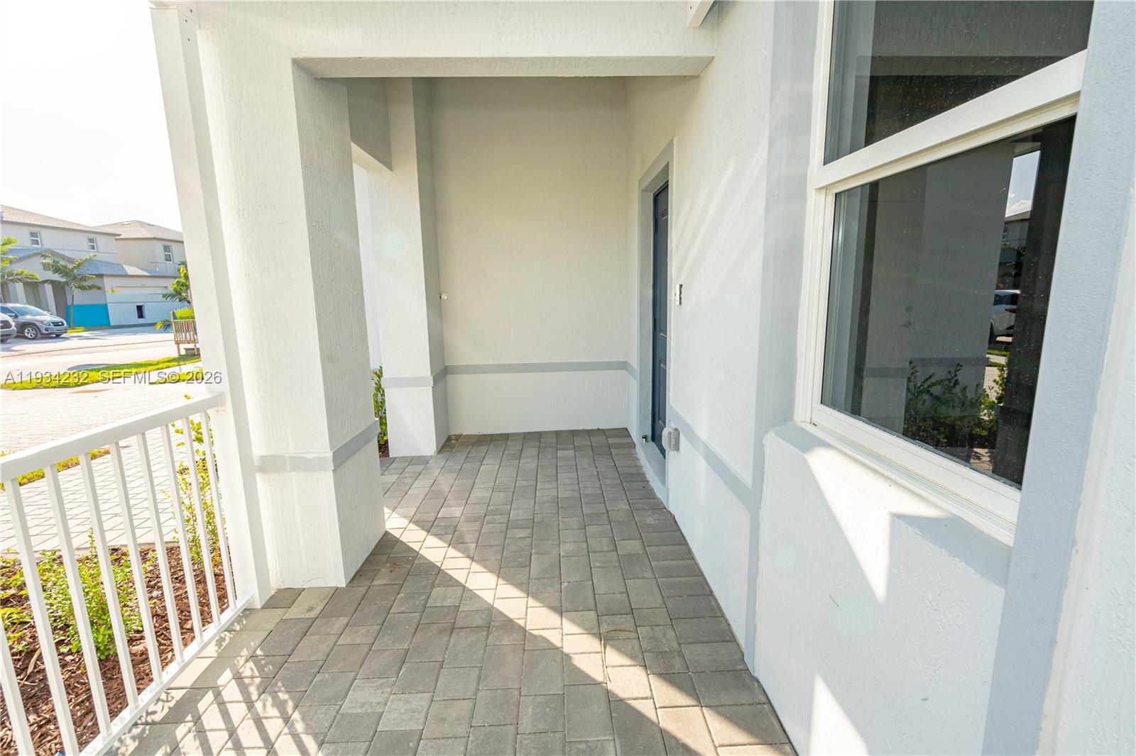 19507 Southwest 339th Terrace Homestead, FL 33034 - Photo 8 of 83 a view of a hallway with wooden floor and door