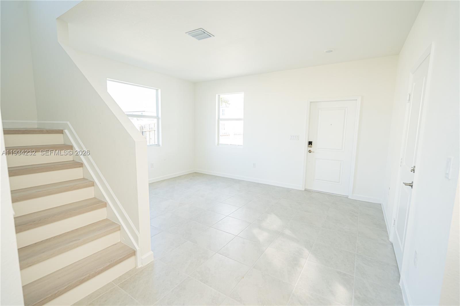 19507 Southwest 339th Terrace Homestead, FL 33034 - Photo 9 of 83 a view of an empty room with stairs