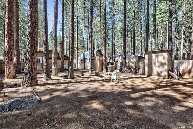 a view of a back yard of the house