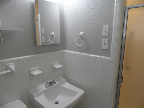 a bathroom with a sink and mirror
