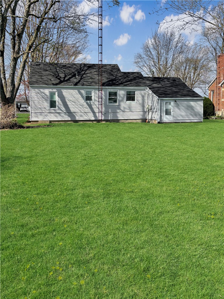 8411 Pitsburg-Laura Road Arcanum, OH 45304 - Photo 16 of 16 This charming home offers a sprawling green lawn, ideal for outdoor enjoyment and relaxation.