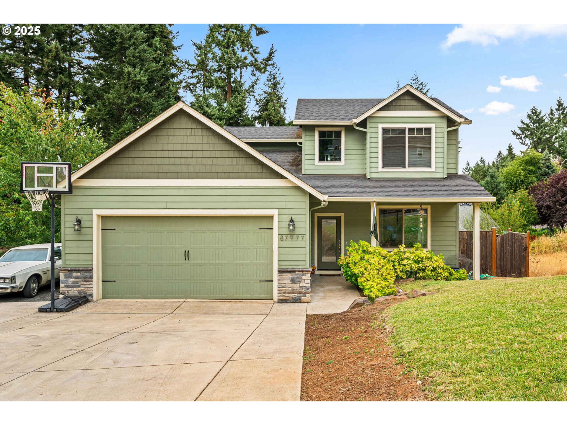 a front view of a house with garden