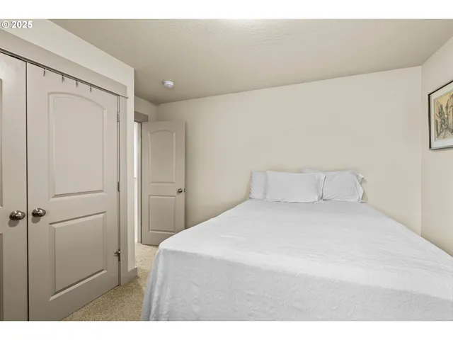 a bedroom with a bed and a cabinets