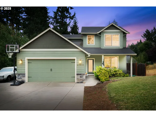 a front view of a house with a garden and plants