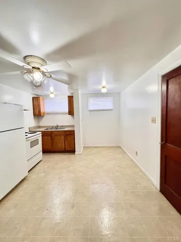 a view of a kitchen with a sink stainless steel appliances and cabinets