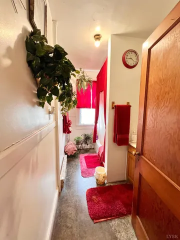 a bathroom with a sink mirror and toilet