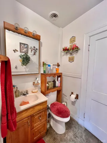 a bathroom with a sink and a shower curtain