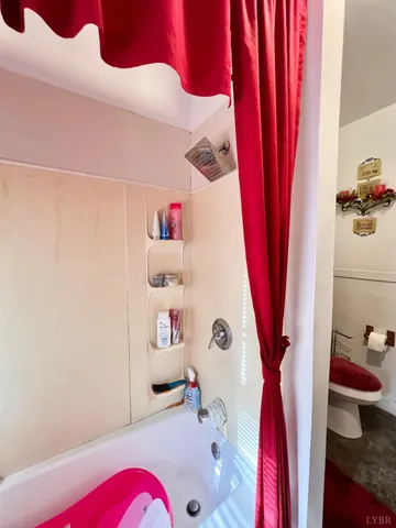 a view of a bedroom with a bed and furniture