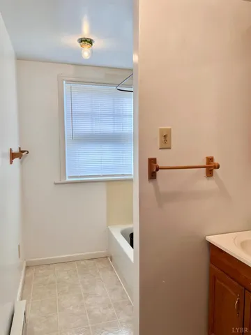 a bathroom with a bath tub and shower