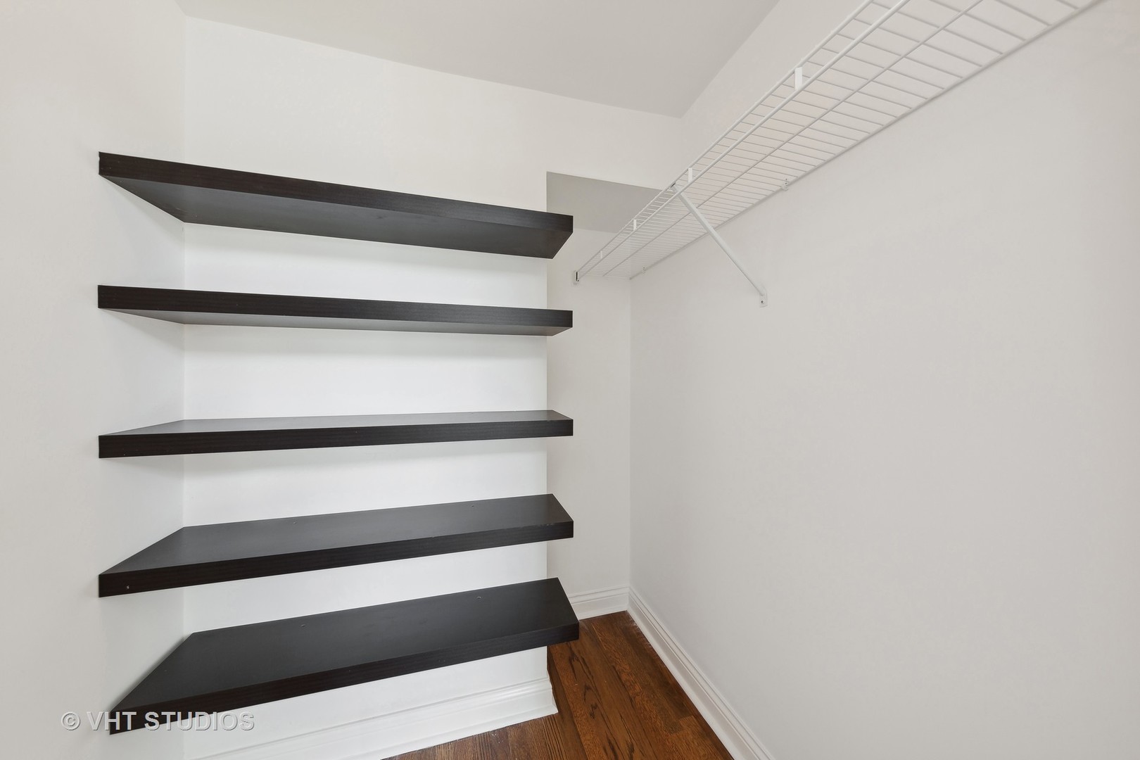 2031 West Augusta Boulevard, Unit 3 Chicago, IL 60622 - Photo 14 of 24 a view of walk in closet with empty racks