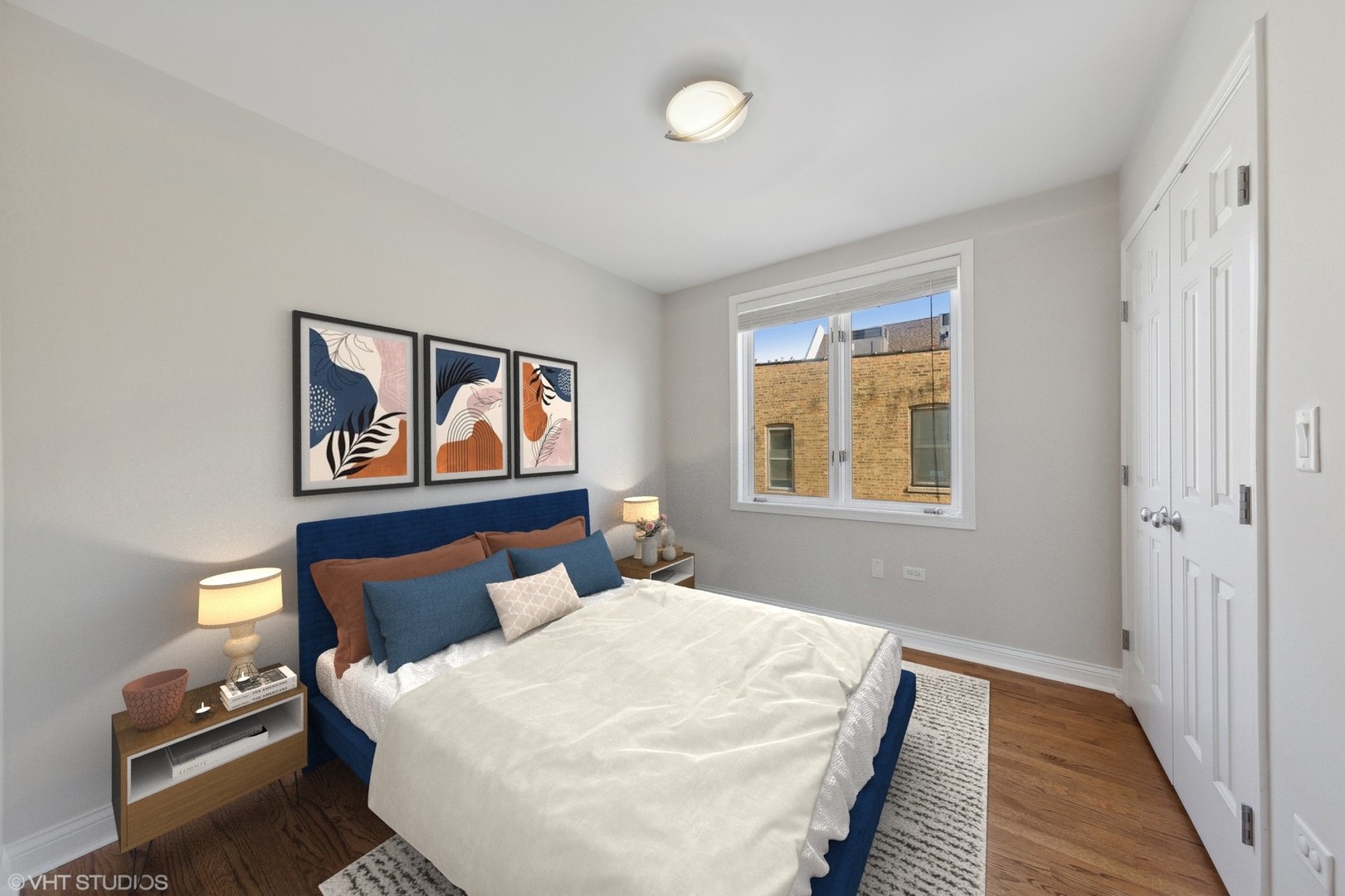 2031 West Augusta Boulevard, Unit 3 Chicago, IL 60622 - Photo 15 of 24 a bedroom with a bed and wooden floor
