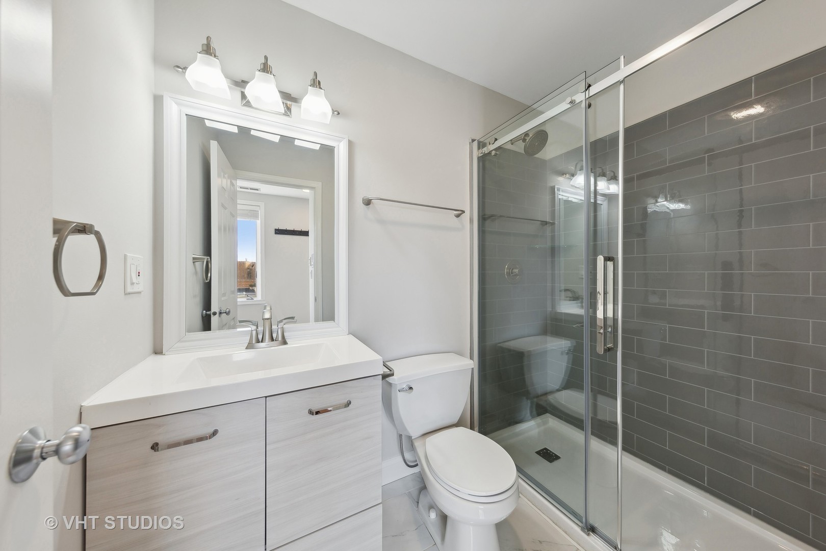 2031 West Augusta Boulevard, Unit 3 Chicago, IL 60622 - Photo 17 of 24 a bathroom with a toilet sink shower and mirror