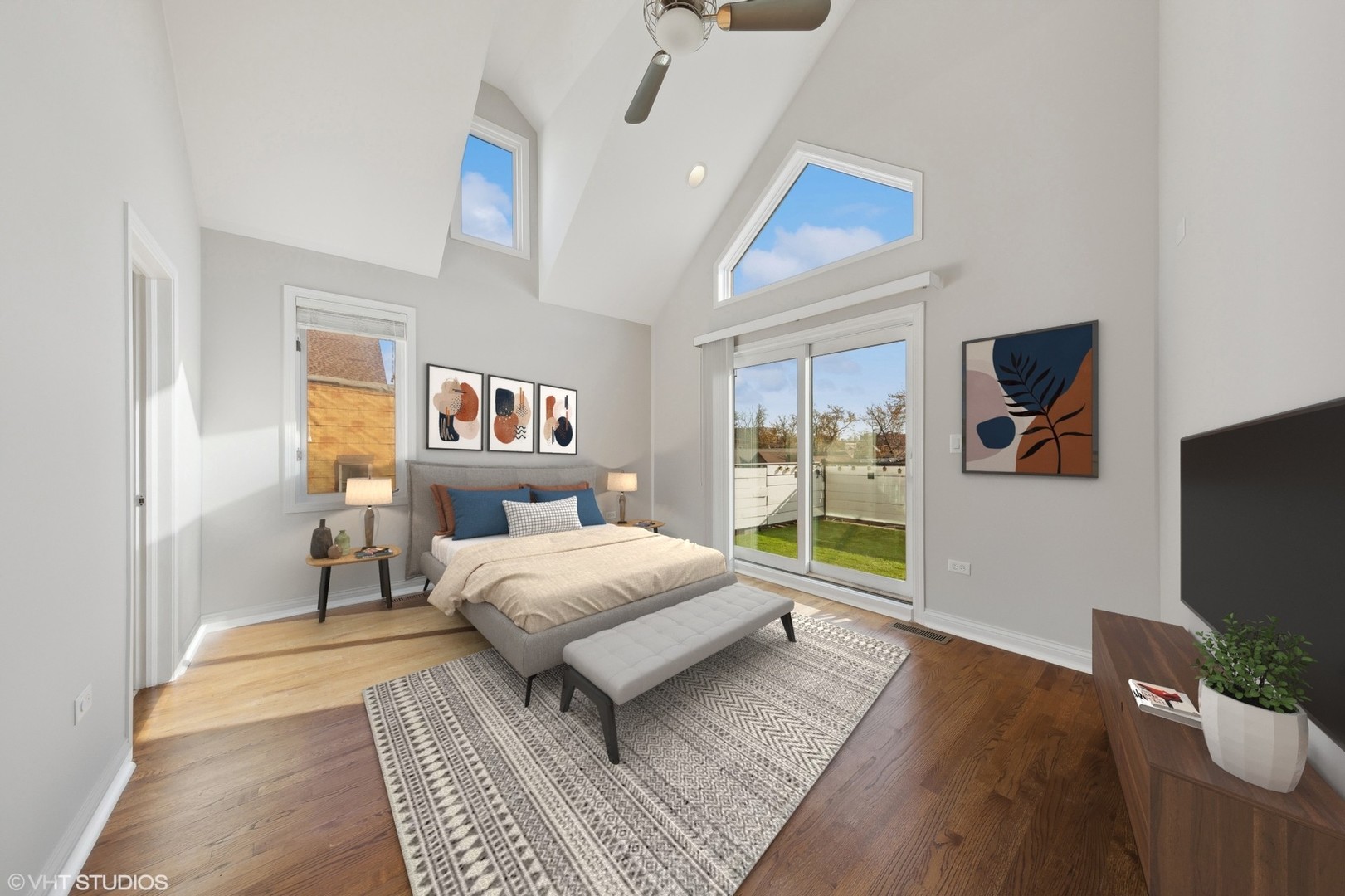 2031 West Augusta Boulevard, Unit 3 Chicago, IL 60622 - Photo 9 of 24 a bedroom with a bed and a flat screen tv