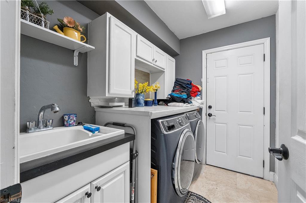 8081 Kansas Road Fort Myers, FL 33967 - Photo 14 of 21 a utility room with dryer and washer