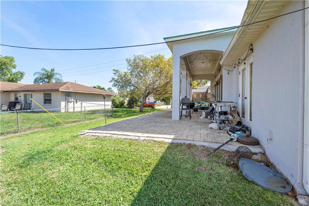 8081 Kansas Road Fort Myers, FL 33967 - Photo 17 of 21 a view of a house with a backyard