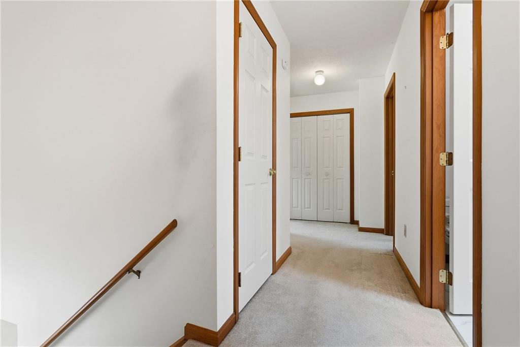 114 Sika Drive Pittsburgh, PA 15239 - Photo 23 of 45 a view of a hallway with wooden floor and a bathroom