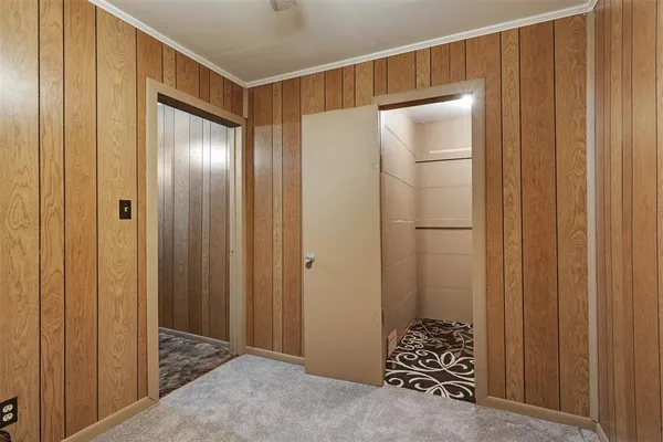 a bathroom with a glass door and shower