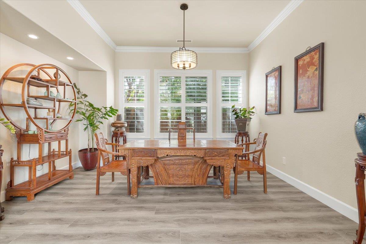1935 St Andrews Circle Gilroy, CA 95020 - Photo 27 of 84 a view of a dining room with furniture a chandelier and wooden floor