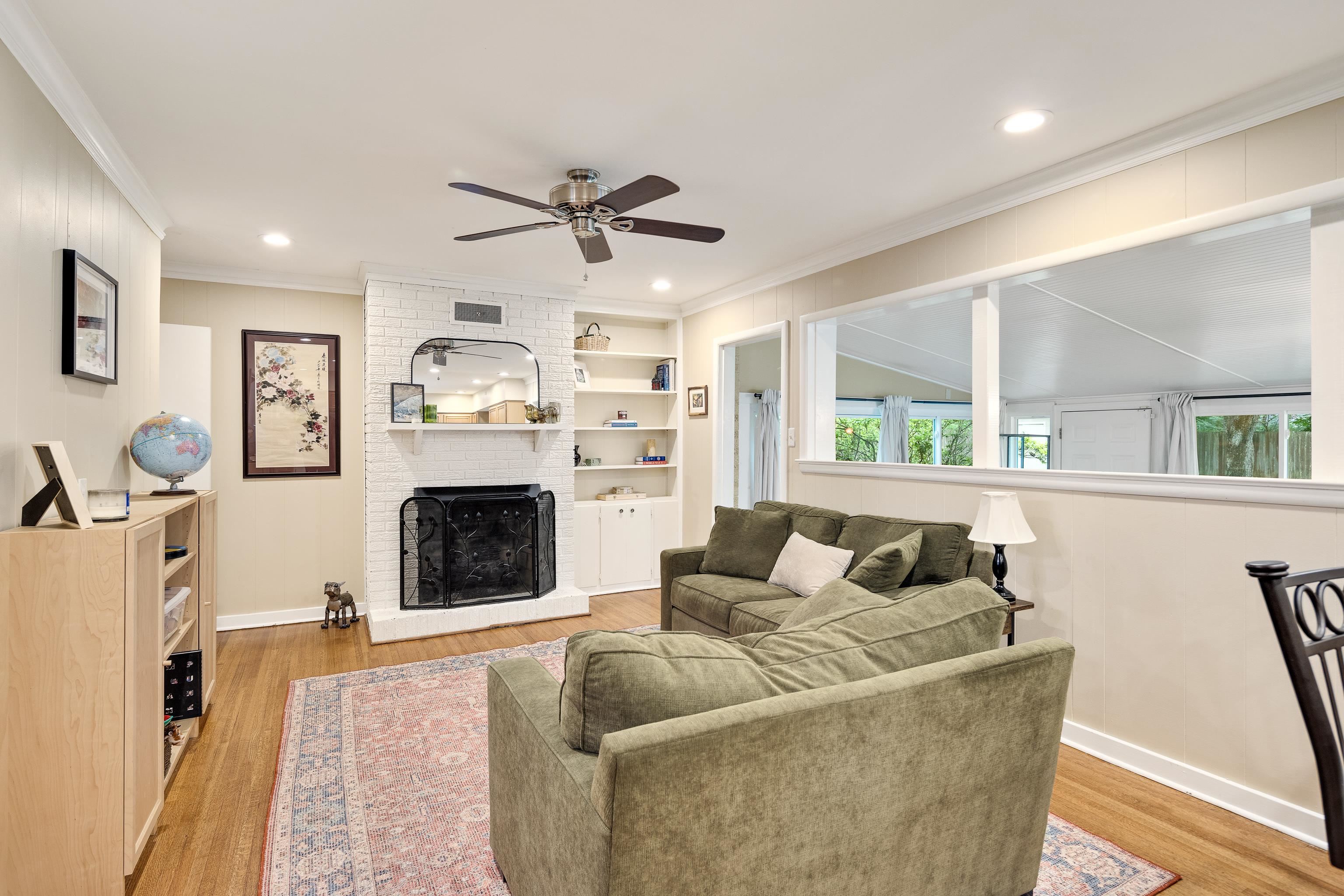 4152 Barfield Road Memphis, TN 38117 - Photo 12 of 37 Living room with ornamental molding, light wood-style flooring, a fireplace, recessed lighting, and ceiling fan