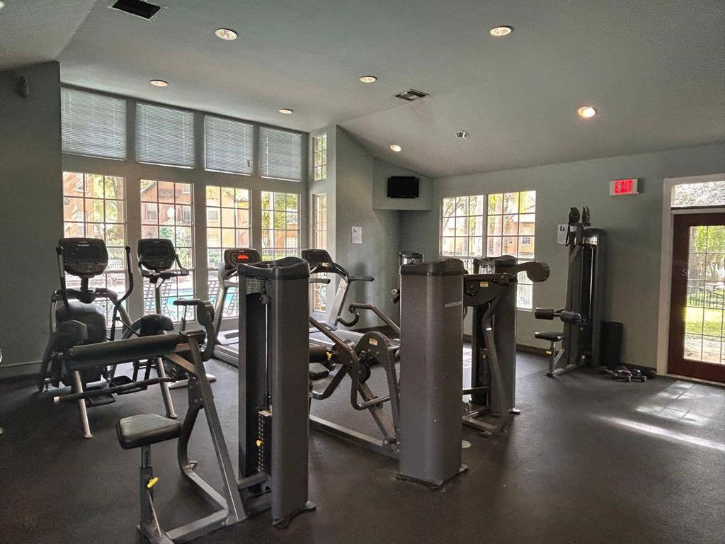 6408 Raleigh Street, Unit 2403 Orlando, FL 32835 - Photo 16 of 18 a view of a room with gym equipment