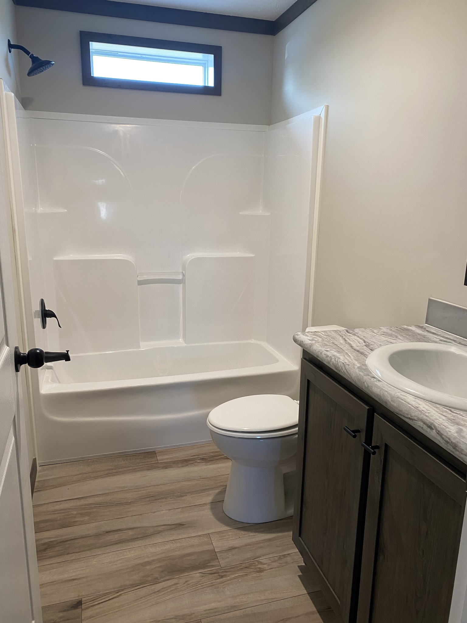 1646 Gamaliel Road Red Boiling Springs, TN 37150 - Photo 17 of 24 a bathroom with a sink a toilet and a bathtub