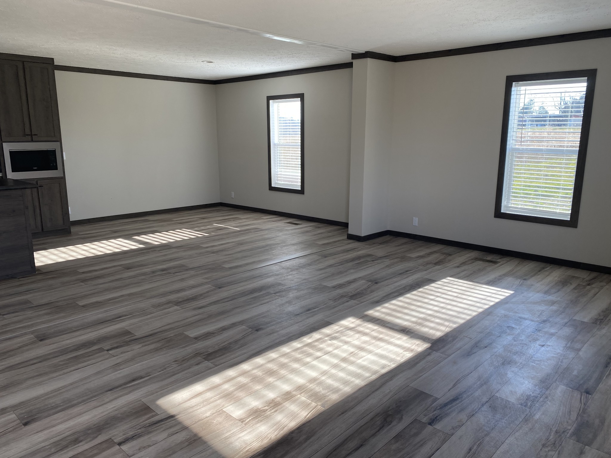 1646 Gamaliel Road Red Boiling Springs, TN 37150 - Photo 4 of 24 an empty room with wooden floor and windows