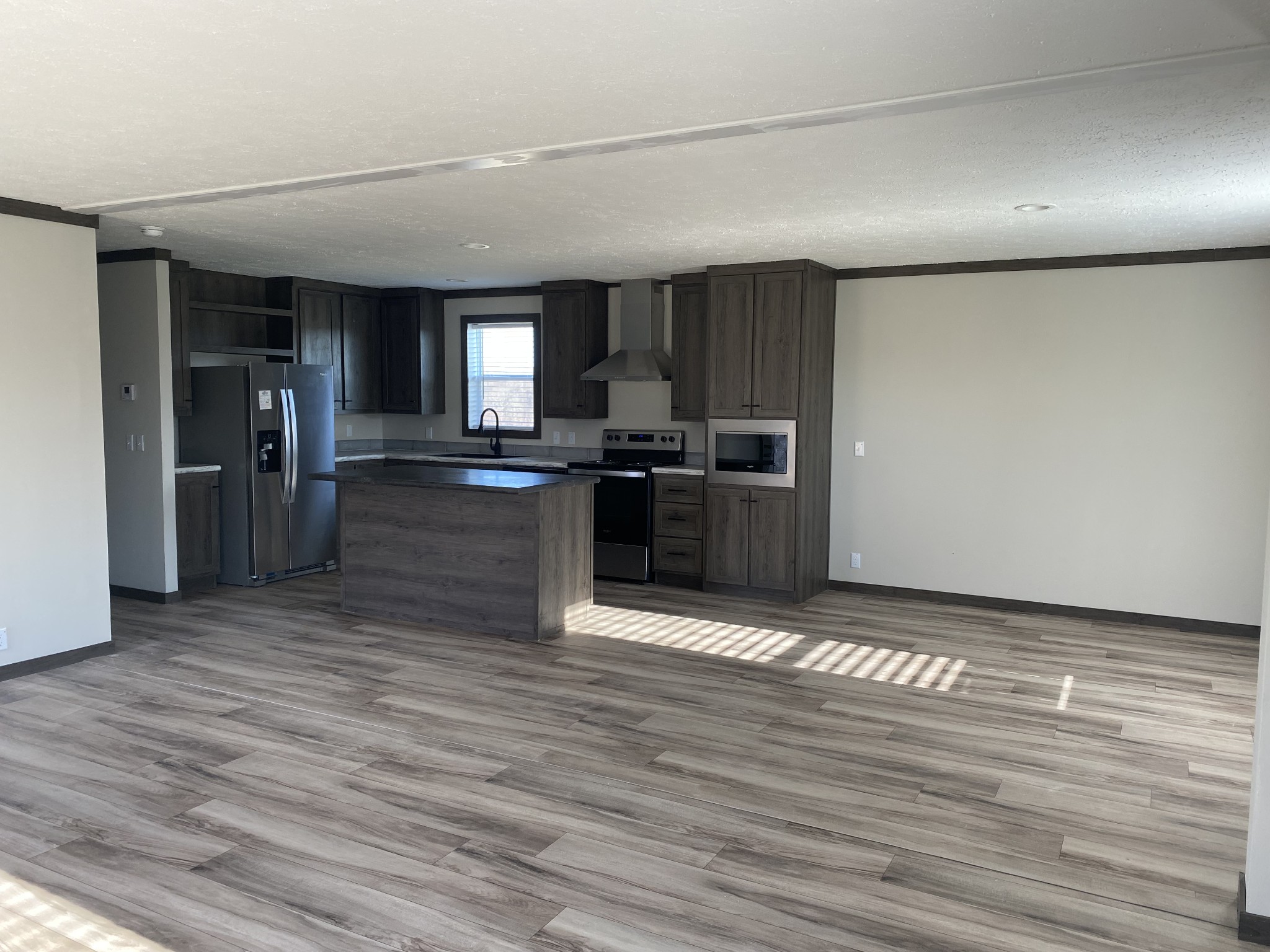 1646 Gamaliel Road Red Boiling Springs, TN 37150 - Photo 5 of 24 a view of a kitchen with a sink and a refrigerator