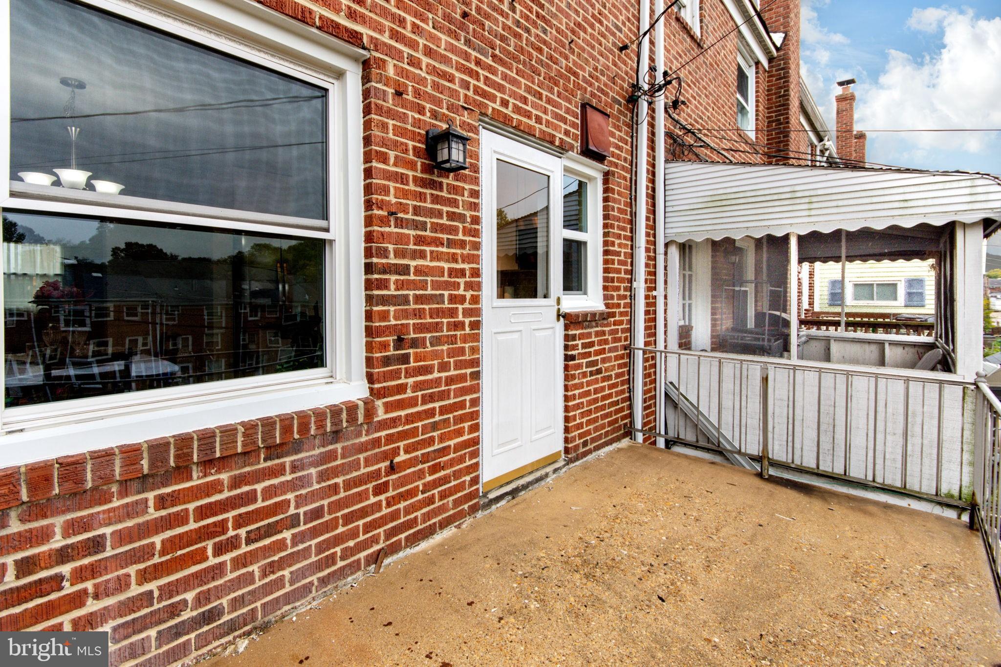 4402 Fenor Road Baltimore, MD 21227 - Photo 9 of 25 Raised porch off kitchen
