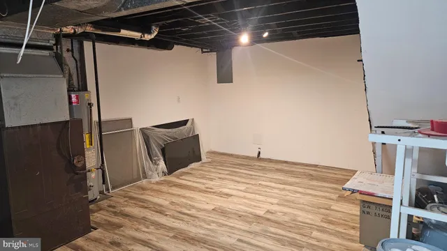 a bedroom with a bed and a flat tv screen