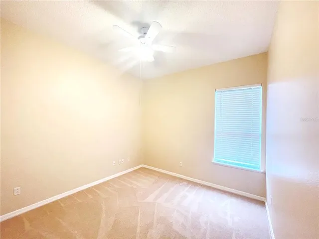 a bathroom with a tub sink shower and a mirror