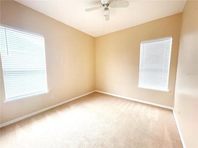 a bathroom with a sink a toilet and a large mirror