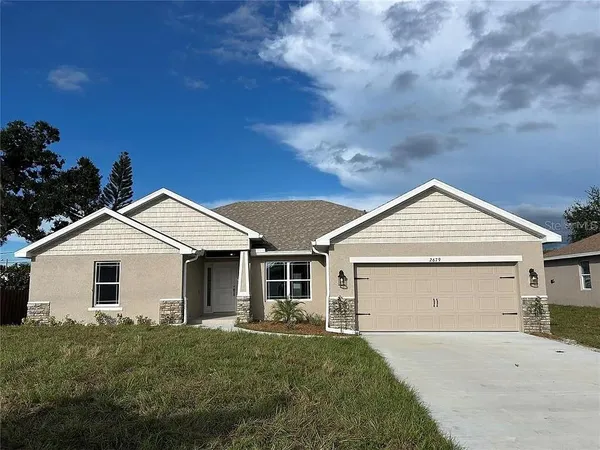 front view of a house with a yard