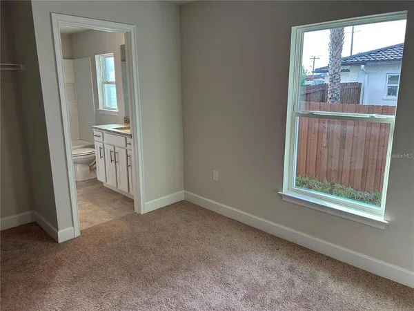 an empty room with windows