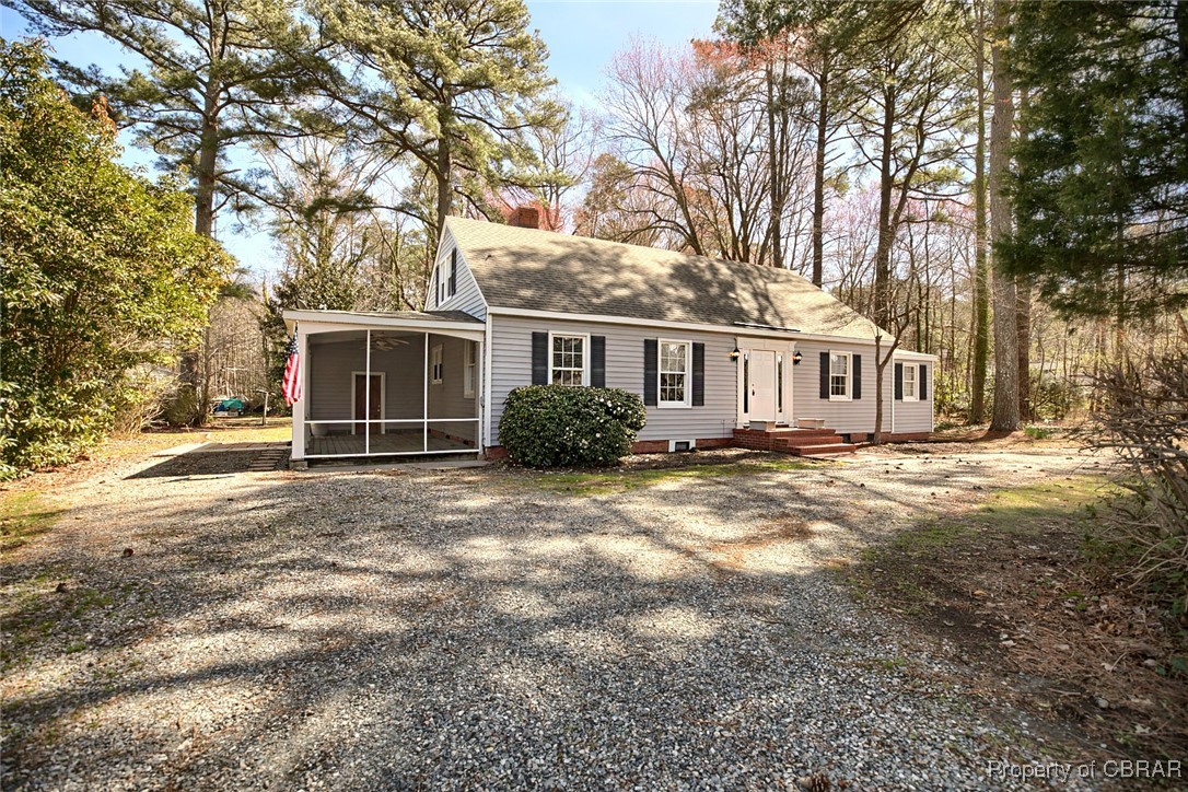 10371 Buckley Hall Road Mathews, VA 23109 - Photo 1 of 28 View of front of property featuring a sunroom and a chimney