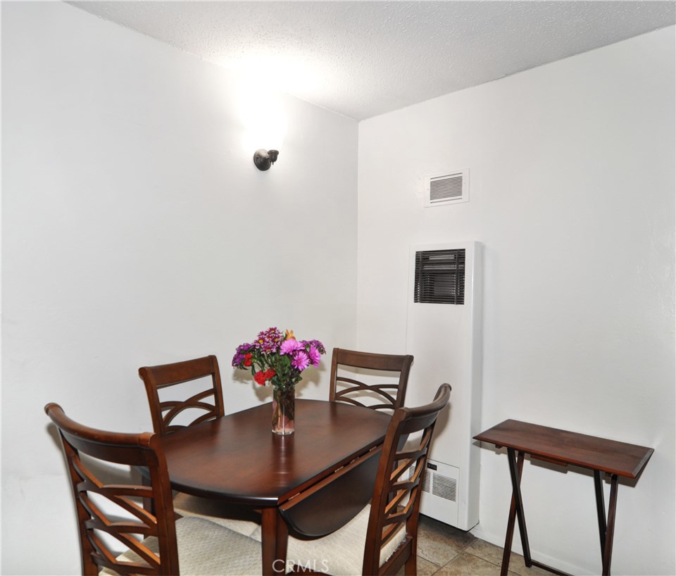 217 10th Street, Unit 4 Seal Beach, CA 90740 - Photo 11 of 45 a view of a dining room with furniture