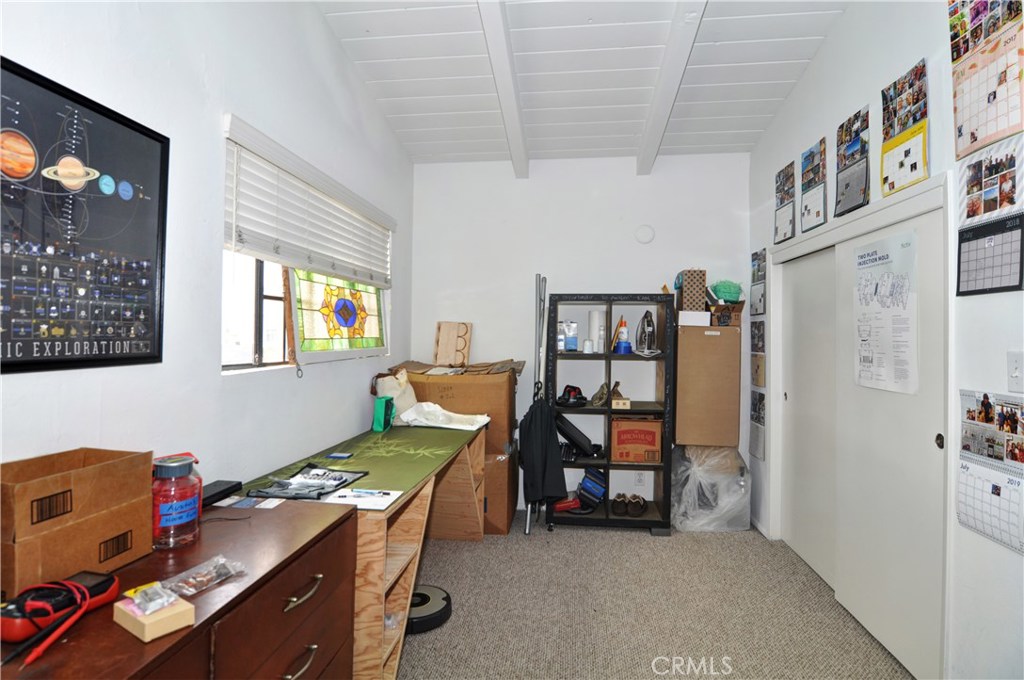 217 10th Street, Unit 4 Seal Beach, CA 90740 - Photo 22 of 45 a room with furniture and a flat screen tv